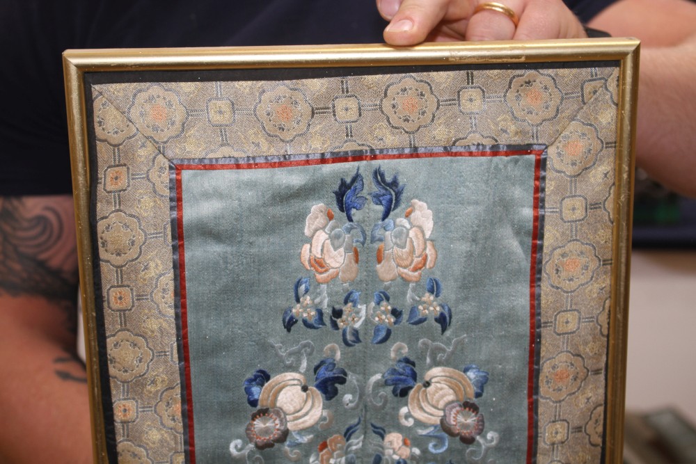 A Chinese silkwork double sleeve panel, 77 x 18cm overall, a smaller floral panel, 61 x 11cm and another, 34 x 26cm overall